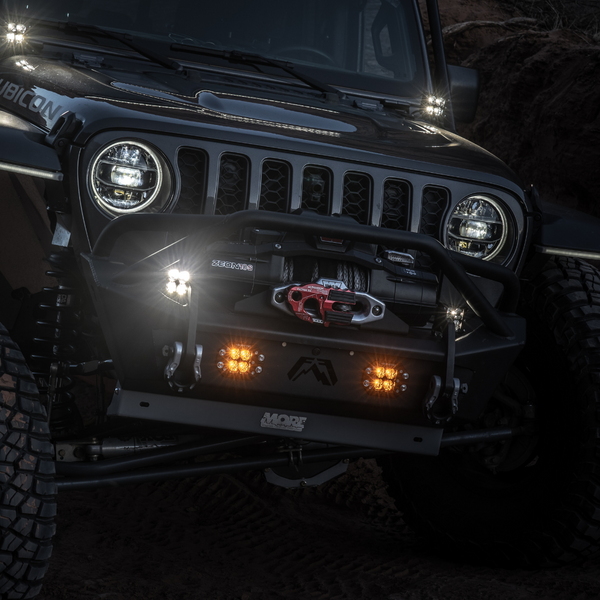 flush mount quattro amber led pod light mounted on a jeep bumper